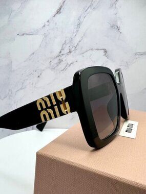 Miu Miu Black Sunglasses with Gold Logo Accents